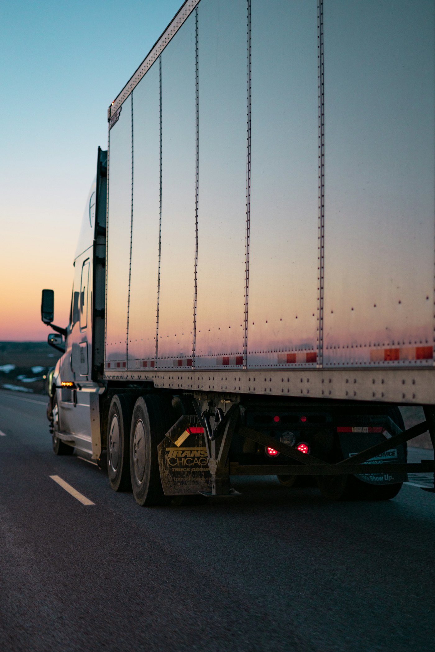 Freight truck traveling on a regional highway during the day